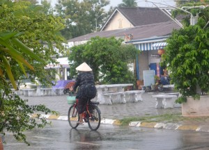 Triangle Hat Cycling Past Daosavanh Restaurant in Savannakhet, French food in Laos