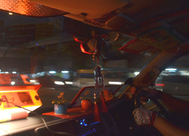 Minivan Driver in Bangkok Traffic at Night, Southeast Asia
