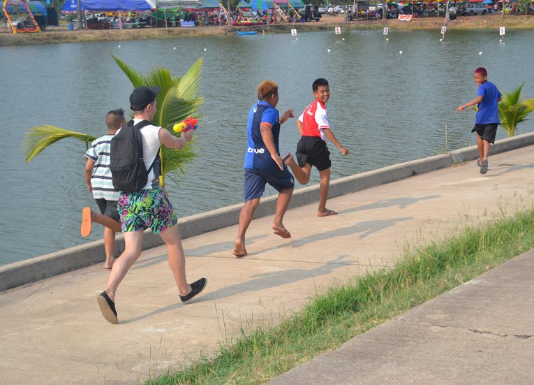 Chasing Kids with Water During Songkran Festival in Thailand
