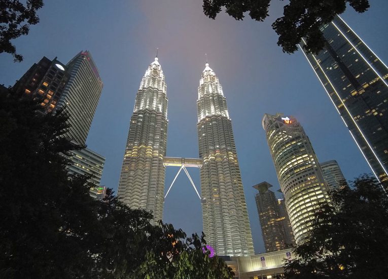 Petronas-Twin-Towers-in-Kuala-Lumpur-at-Night-from-Singapore-to-Thailand-by-Train